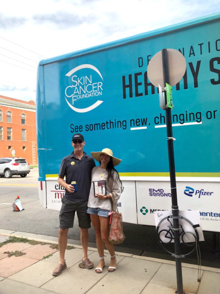 This happy couple in Boulder proudly showed off their “I just got screened” stickers.