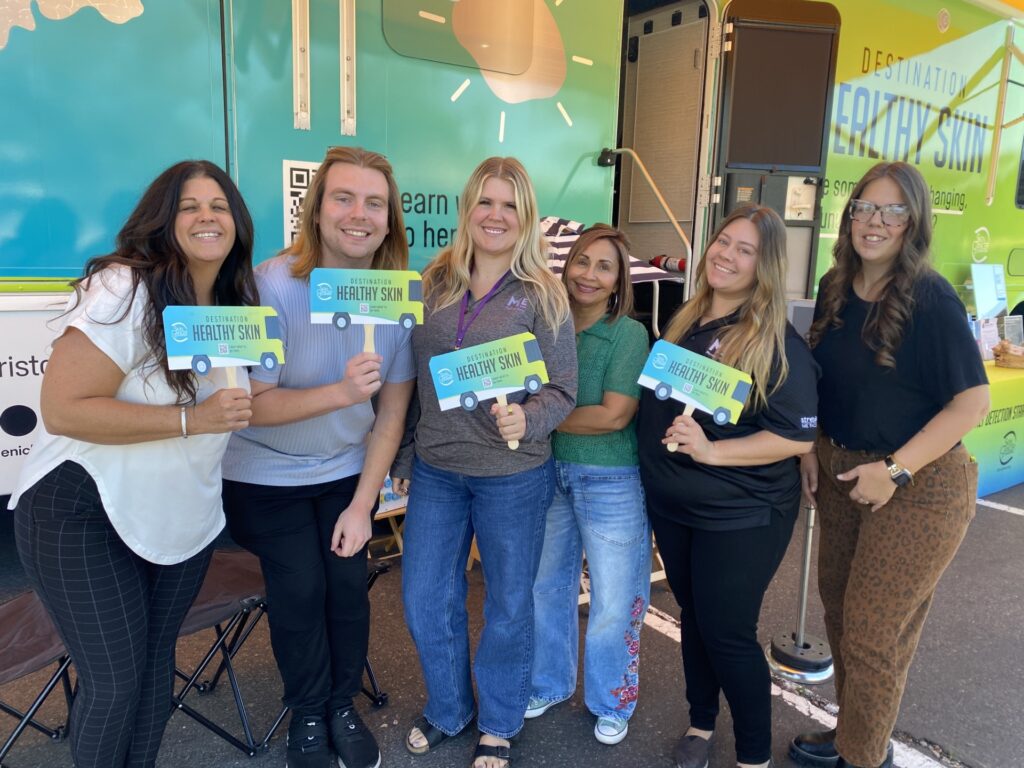 Our friends at Massage Envy show off their Destination Healthy Skin fans in Scottsdale.