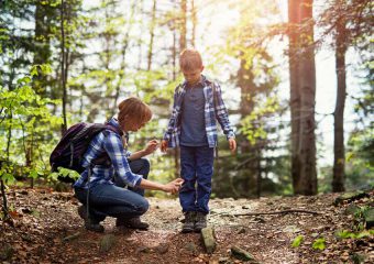 mother spraying insect repellent