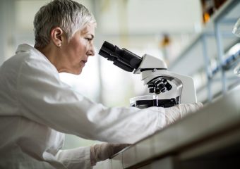 Scientist with microscope