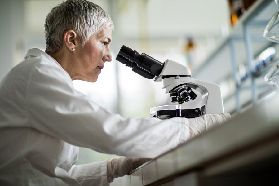 Scientist with microscope