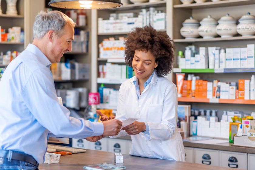 pharmacist advising customer about prescription